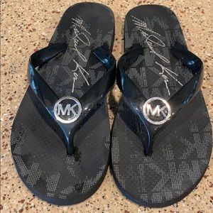 Michael Kors black flip flops